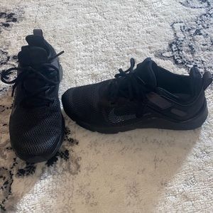 Womens black Nike Legend Essential sneakers. Size 7.